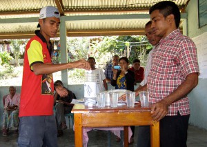 A community member votes.