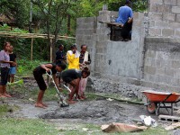 Women mixing cement.