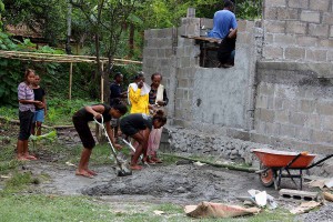 Women mixing cement.