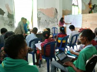 A teacher talks to the class.