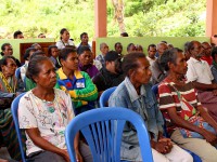 Community members listen to a presentation.