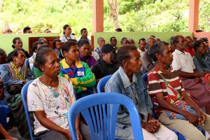 Community members listen to a presentation.