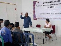 A man explains PNDS to a room of people.
