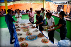Women from the community in Sabuli serve lunch in the new community centre as part of the inauguration ceremony.