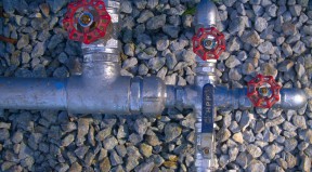 Close up of the taps on Suku Tokolui's new water tank