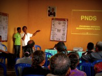 1. A man explains PNDS to community leaders