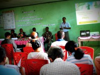 1. A man explains PNDS to community leaders
