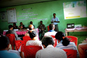 1. A man explains PNDS to community leaders