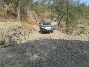 A car on a dirt road 