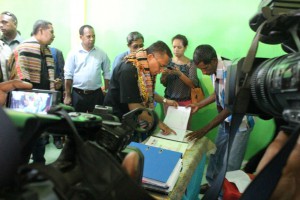 Prime Minister, Rui Maria de Araujo, checks the community budget expenditures book, namely the operational and infrastructure budget expenditure