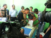Prime Minister, Rui Maria de Araujo, checks the community budget expenditures book of the PNDS program implementation.