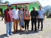 Angela Robinson, Australia Vice- Ambassador (black trousers) together with the PNDS technical team in front of Soro Community Centre